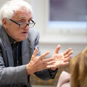 Jan Gross speaks with a student