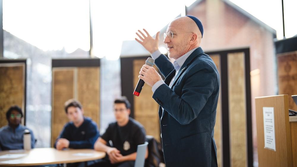 Yossi Chajes speaks to students about manuscripts