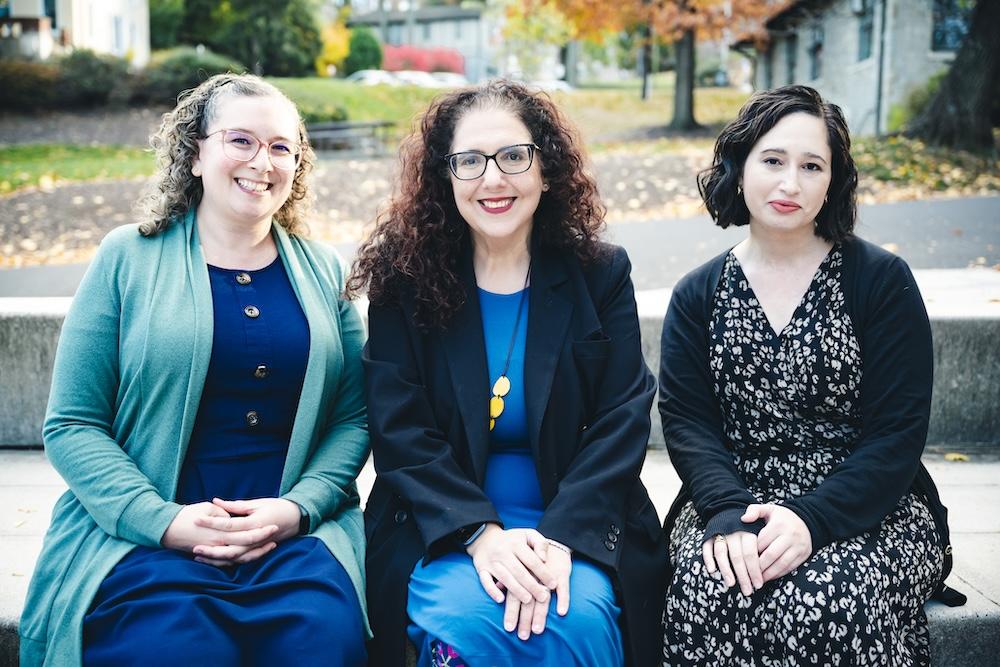 Gross, Eichler Levine, and Krone pose for a photo outside in the fall.
